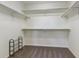 Empty walk-in closet features shelving at 23593 E Chenango Pl, Aurora, CO 80016