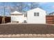 Backyard featuring a clean and tidy space, a white house, and mulch with brick edging at 1130 Orchard St, Golden, CO 80401