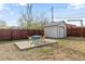 Spacious backyard with a patio area, surrounded by a wooden fence, perfect for outdoor entertaining at 1130 Orchard St, Golden, CO 80401