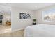 Inviting bedroom featuring a queen size bed, wood floors and doorway looking into the kitchen at 1130 Orchard St, Golden, CO 80401