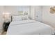 Comfortable bedroom featuring a queen size bed, wood floors and a unique bedside lamp at 1130 Orchard St, Golden, CO 80401