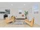Bright living room features light hardwood floors, and ample natural light, and provides an open floor plan at 1130 Orchard St, Golden, CO 80401