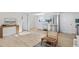 Bright living room features light hardwood floors, and ample natural light, and provides an open floor plan at 1130 Orchard St, Golden, CO 80401