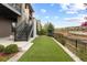 Beautiful backyard with artificial turf and landscaping, perfect for outdoor activities at 10113 Bellwether Ln, Lone Tree, CO 80124