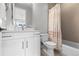 Bathroom features neutral subway tile, white vanity, and shower-tub combo at 10113 Bellwether Ln, Lone Tree, CO 80124