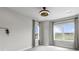 Bright bedroom with views, recessed lighting, and two large windows at 10113 Bellwether Ln, Lone Tree, CO 80124