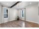 Versatile bonus room with hardwood floors and large windows, perfect for an office or playroom at 10113 Bellwether Ln, Lone Tree, CO 80124