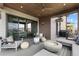 Luxurious covered patio with a cozy seating area and fire pit perfect for entertaining at 10113 Bellwether Ln, Lone Tree, CO 80124