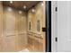 Close-up of the interior of an elevator featuring paneled walls, control panels and overhead lights at 10113 Bellwether Ln, Lone Tree, CO 80124