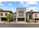 Stylish three-story home featuring an attached two-car garage and neutral exterior color palette at 10113 Bellwether Ln, Lone Tree, CO 80124