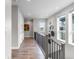 Upstairs hallway features hardwood flooring, neutral paint, and views from windows at 10113 Bellwether Ln, Lone Tree, CO 80124