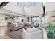 Bright living room with high ceilings, fireplace, modern furniture, and an open-concept design at 10113 Bellwether Ln, Lone Tree, CO 80124
