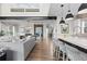 Spacious living area featuring a kitchen island, dining area, and comfortable seating arrangement at 10113 Bellwether Ln, Lone Tree, CO 80124