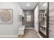 Charming mudroom with wood-look accent wall, coat rack, bench, and large mirror at 10113 Bellwether Ln, Lone Tree, CO 80124