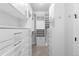 Organized walk-in closet featuring custom shelving, drawers, and ample hanging space for storage at 10113 Bellwether Ln, Lone Tree, CO 80124
