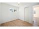 Well-lit bedroom featuring hardwood floors and a spacious closet for storage at 1151 Xanthia St, Denver, CO 80220