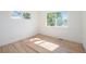 Sunlit bedroom with refinished hardwood floors at 1151 Xanthia St, Denver, CO 80220
