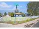 Charming single-story home featuring a white picket fence and a well-manicured lawn at 1151 Xanthia St, Denver, CO 80220