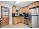 The kitchen offers granite countertops, stainless steel appliances, and tile flooring at 1151 Xanthia St, Denver, CO 80220