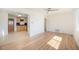 Bright living room featuring hardwood floors, ceiling fan, and natural light at 1151 Xanthia St, Denver, CO 80220