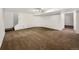 Spacious basement with plush carpeting, offering a versatile recreational area at 12375 Ivy Pl, Brighton, CO 80602