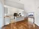 Inviting kitchen with ample cabinet space and a view to the open living room at 12375 Ivy Pl, Brighton, CO 80602