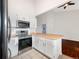 Kitchen featuring stainless steel appliances and a breakfast bar with bright natural light at 12375 Ivy Pl, Brighton, CO 80602