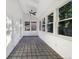 Bright sunroom with beautiful tile flooring and natural light throughout at 12375 Ivy Pl, Brighton, CO 80602
