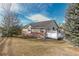 House exterior with a deck and well-maintained yard at 20697 E Lake Ave, Centennial, CO 80016