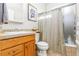 Full bathroom with shower/tub combo and wood vanity at 20697 E Lake Ave, Centennial, CO 80016