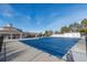 Community pool with a cover, surrounded by a clubhouse and trees at 20697 E Lake Ave, Centennial, CO 80016