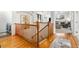 Elegant wooden staircase leading to upper level with hardwood floors at 20697 E Lake Ave, Centennial, CO 80016