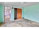 Bright bedroom with closet, painted walls, and natural light from the window at 445 S Depew St, Lakewood, CO 80226