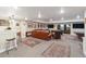 Basement with a sitting area, a bar, a pool table, and a view of the outdoors at 1995 Wingfeather Ln, Castle Rock, CO 80108