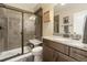 Bathroom features a glass enclosed shower, granite countertop vanity and tile flooring at 1995 Wingfeather Ln, Castle Rock, CO 80108