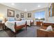 Bright bedroom featuring twin beds, neutral walls, art, and a large window with mountain views at 1995 Wingfeather Ln, Castle Rock, CO 80108
