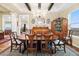 Formal dining room featuring a decorative chandelier, built-in hutch, and large windows with scenic views at 1995 Wingfeather Ln, Castle Rock, CO 80108
