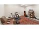 Exercise room featuring a bicycle and a sound system over a patterned rug at 1995 Wingfeather Ln, Castle Rock, CO 80108
