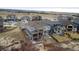 Aerial view of the two-story home, showcasing the landscaping, backyard, and a scenic neighborhood at 1995 Wingfeather Ln, Castle Rock, CO 80108
