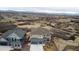 Suburban home, featuring stone accents, a three car garage, and mountain views at 1995 Wingfeather Ln, Castle Rock, CO 80108