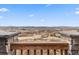 Breathtaking scenic view from a home featuring a panoramic vista and stone accents at 1995 Wingfeather Ln, Castle Rock, CO 80108