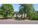 House with mature trees and a well-maintained lawn at 2311 W 46Th Ave, Denver, CO 80211