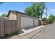 Detachable two-car garage with light beige walls and a gray trim at 2311 W 46Th Ave, Denver, CO 80211