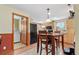 Kitchen with light wood cabinets and a small dining table at 2311 W 46Th Ave, Denver, CO 80211