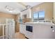 Convenient laundry room with washer, dryer, and cabinets at 2311 W 46Th Ave, Denver, CO 80211