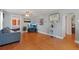 Living room featuring hardwood floors and a flat-screen TV at 2311 W 46Th Ave, Denver, CO 80211