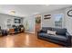 Living room with hardwood floors, a couch and home office space at 2311 W 46Th Ave, Denver, CO 80211