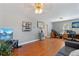 Open living room with hardwood floors, a couch and home office at 2311 W 46Th Ave, Denver, CO 80211