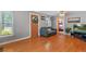 Bright living room with hardwood floors and a view into another room at 2311 W 46Th Ave, Denver, CO 80211