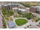 Aerial view showcases lush park with urban apartments and convenient street access at 20 Wilcox St # 318, Castle Rock, CO 80104
